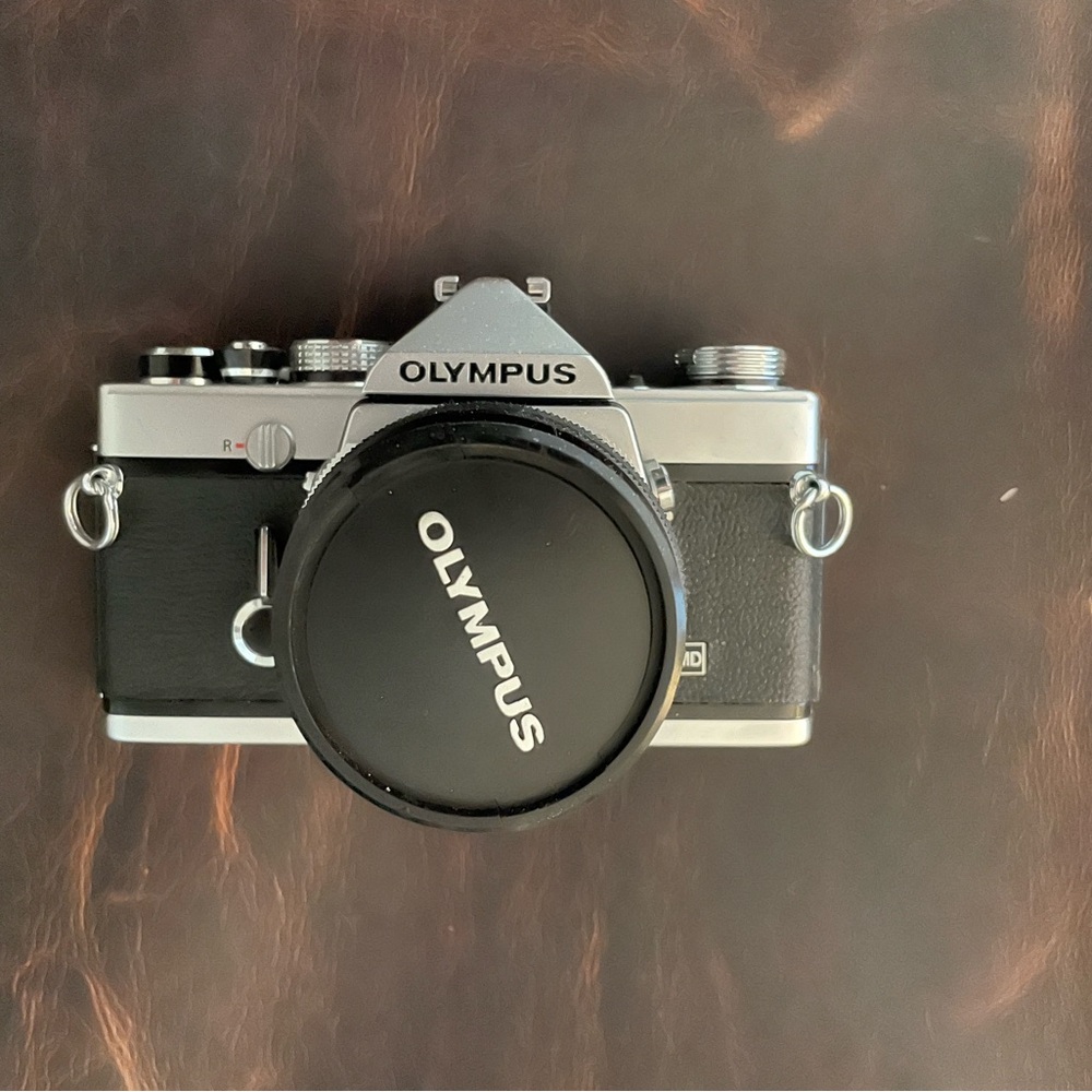 Olympus Black and Silver Camera OM-1 35mm film w/50mm lens